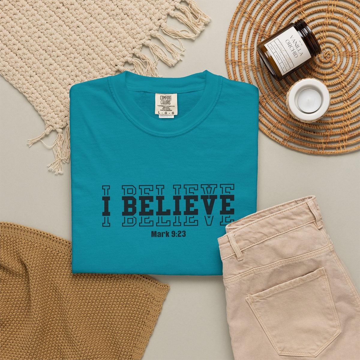 Crown N Thread teal heavyweight ring-spun cotton graphic t-shirt with I Believe Mark 9:23 text on a flat lay background