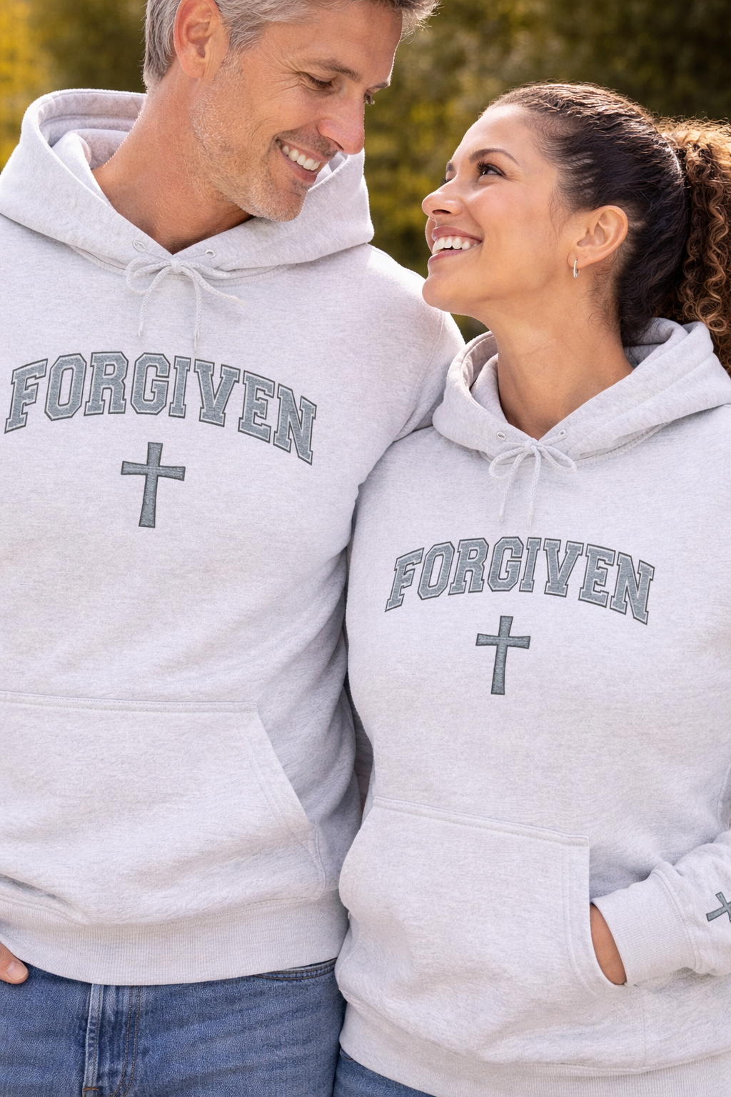 Embroidered Forgiven Cross Hoodie with sleeve design — Christian Faith Graphic Hoodie