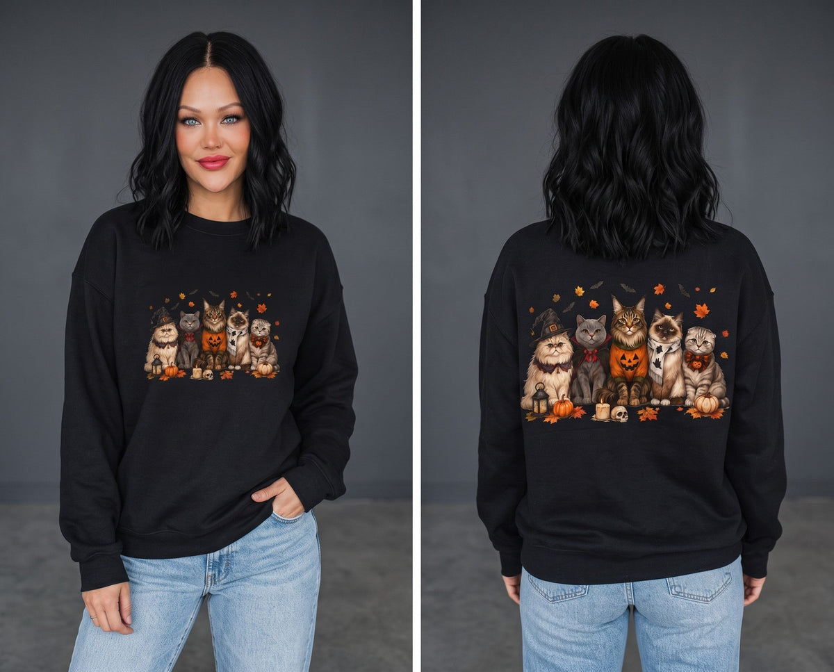 Crown N Thread black crewneck sweatshirt featuring an embroidered autumn cat and pumpkin scene on a female model.
