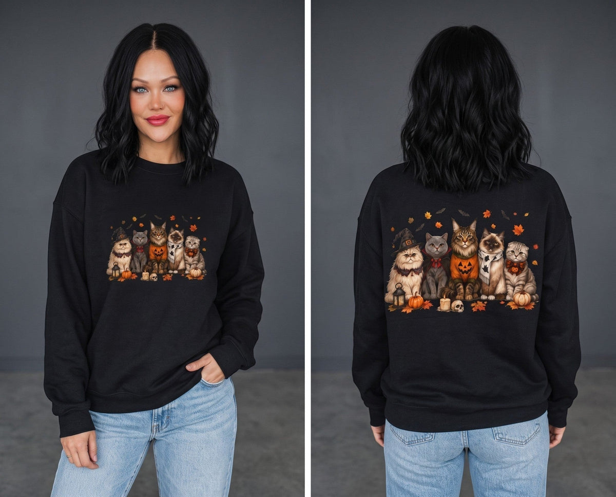 Crown N Thread black crewneck sweatshirt featuring an embroidered fall cat and pumpkin scene on a woman
