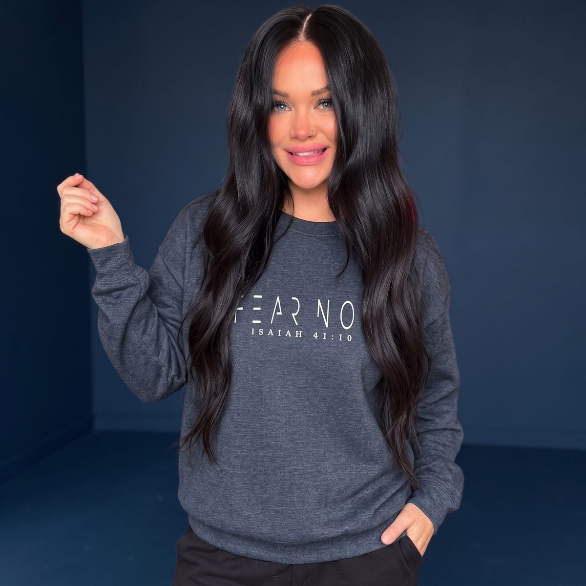 Woman wearing a Crown N Thread charcoal grey crewneck sweatshirt with Fear Not Isaiah 41:10 embroidery