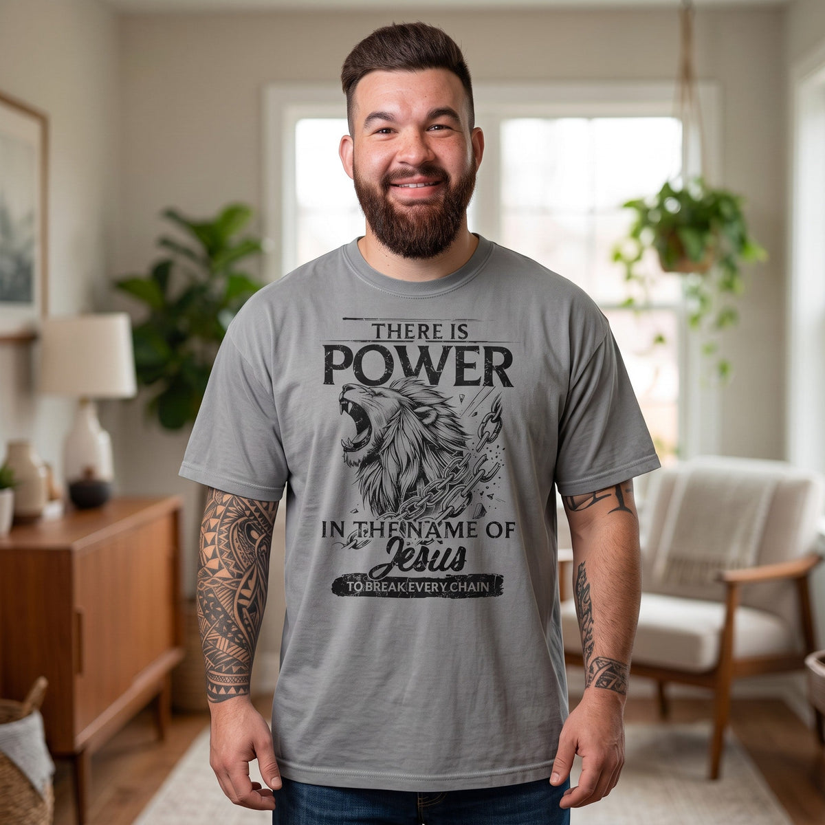 Crown N Thread grey heavyweight cotton t-shirt featuring a lion graphic and Christian text on a smiling bearded man.