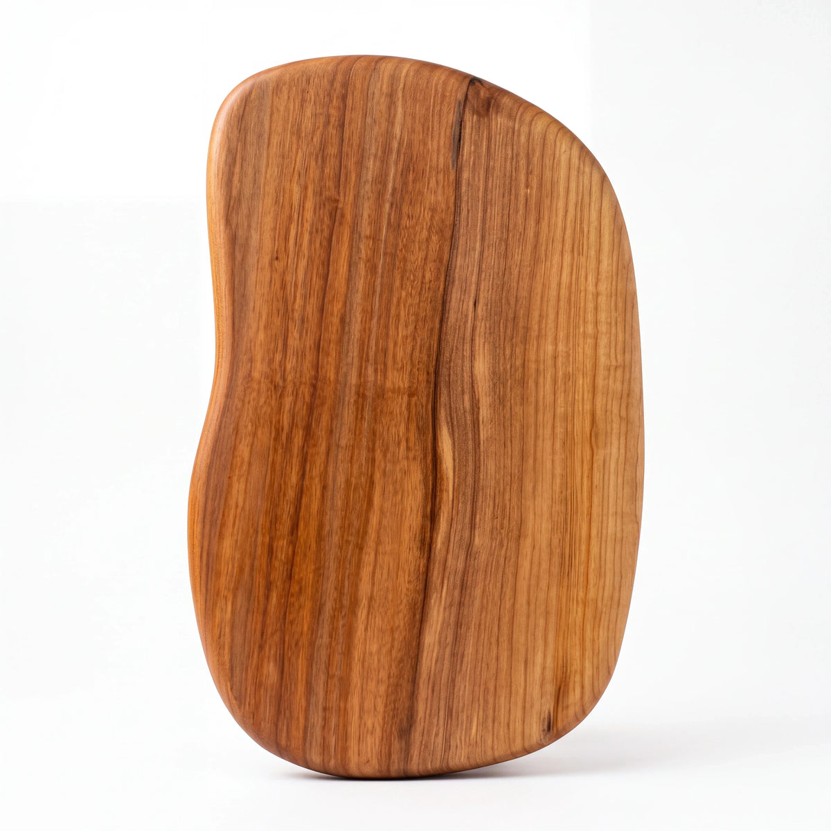 Crown N Thread handmade wooden charcuterie board with a unique organic shape and natural wood grain finish.