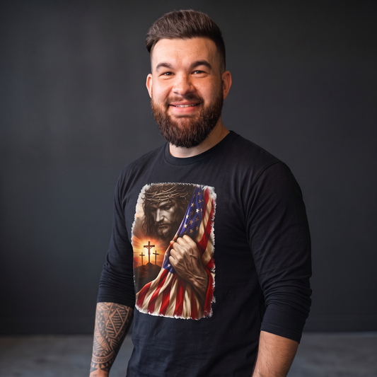 A bearded man wearing a Crown N Thread black long-sleeve tee featuring a graphic of Jesus, crosses, and a US flag.