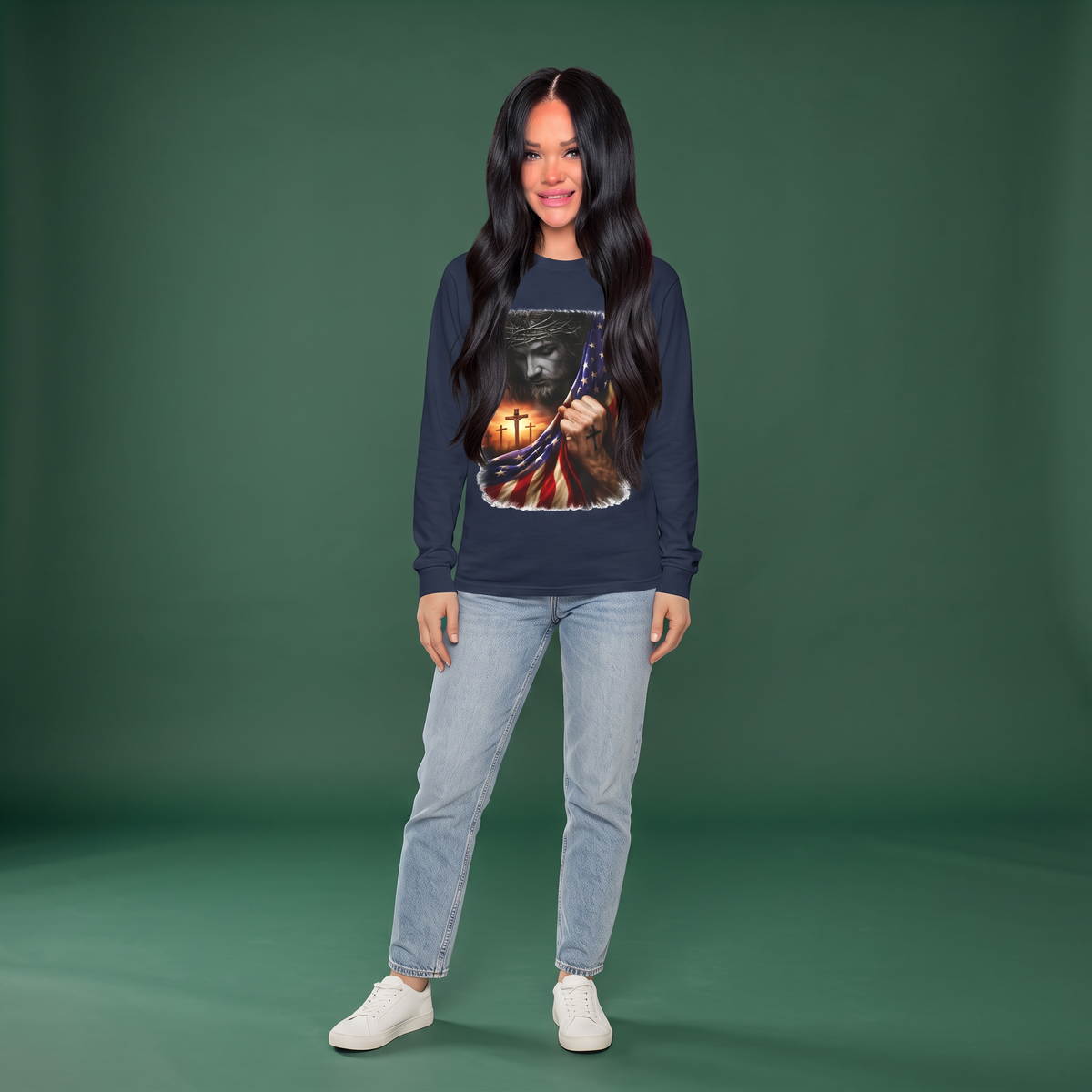 Woman wearing a Crown N Thread navy long-sleeve tee with a Jesus and American flag graphic, paired with light jeans.