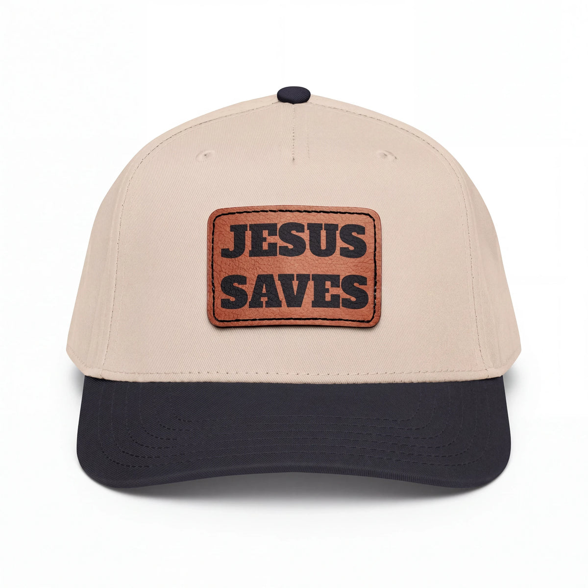 Crown N Thread baseball cap with a beige crown, dark brim, and a light brown vegan leather Jesus Saves patch.