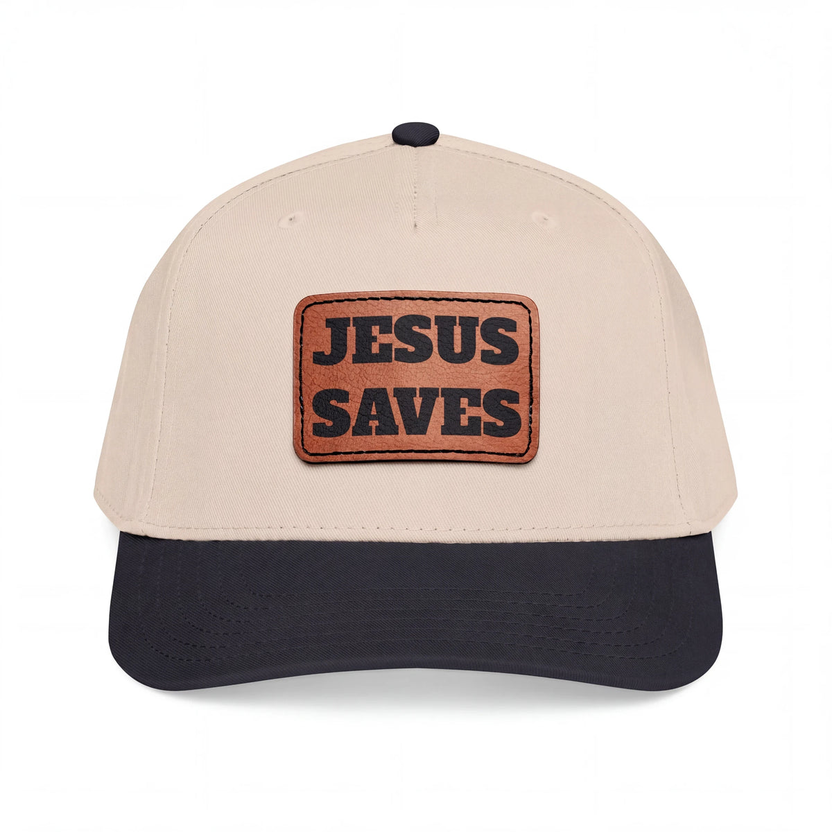 Crown N Thread baseball cap with a beige crown, dark brim, and a light brown vegan leather Jesus Saves patch.