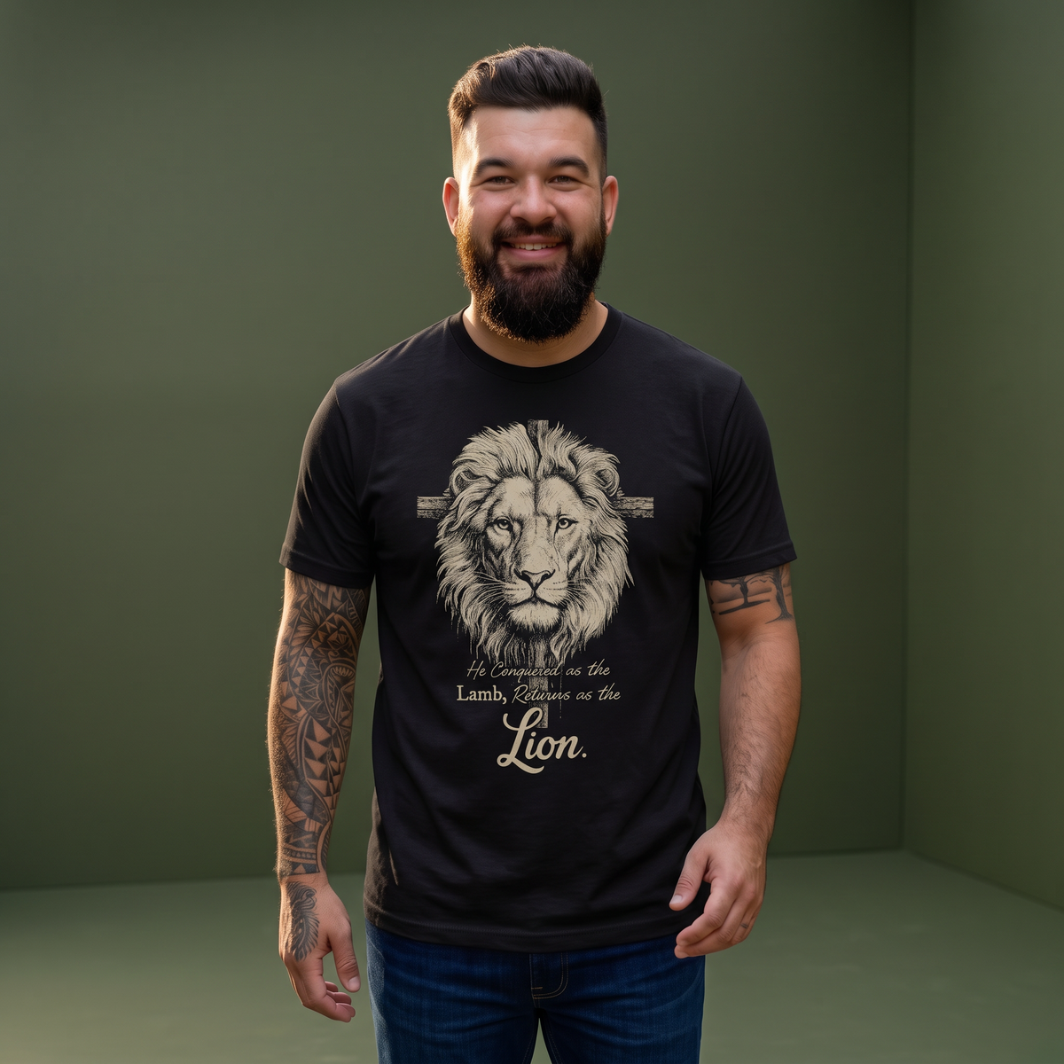 A bearded man wearing a black Crown N Thread graphic tee featuring a detailed lion illustration and religious text.