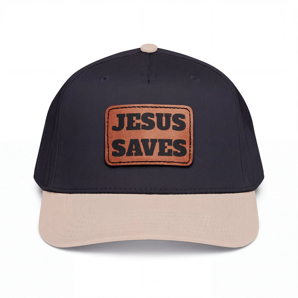 Crown N Thread baseball cap featuring a dark navy crown, light beige brim, and a brown vegan leather Jesus Saves patch.