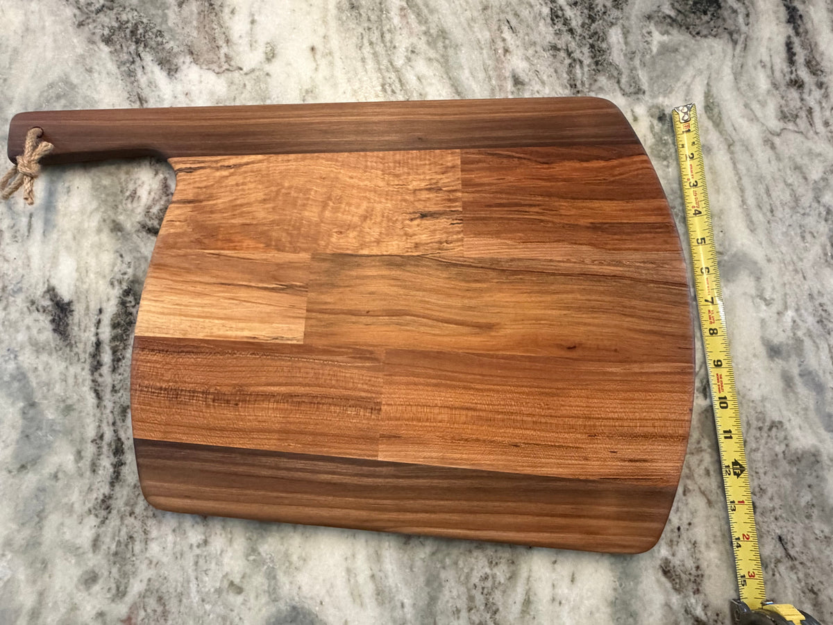 Crown N Thread handmade oiled wood charcuterie board with a rustic rope handle and natural grain patterns.