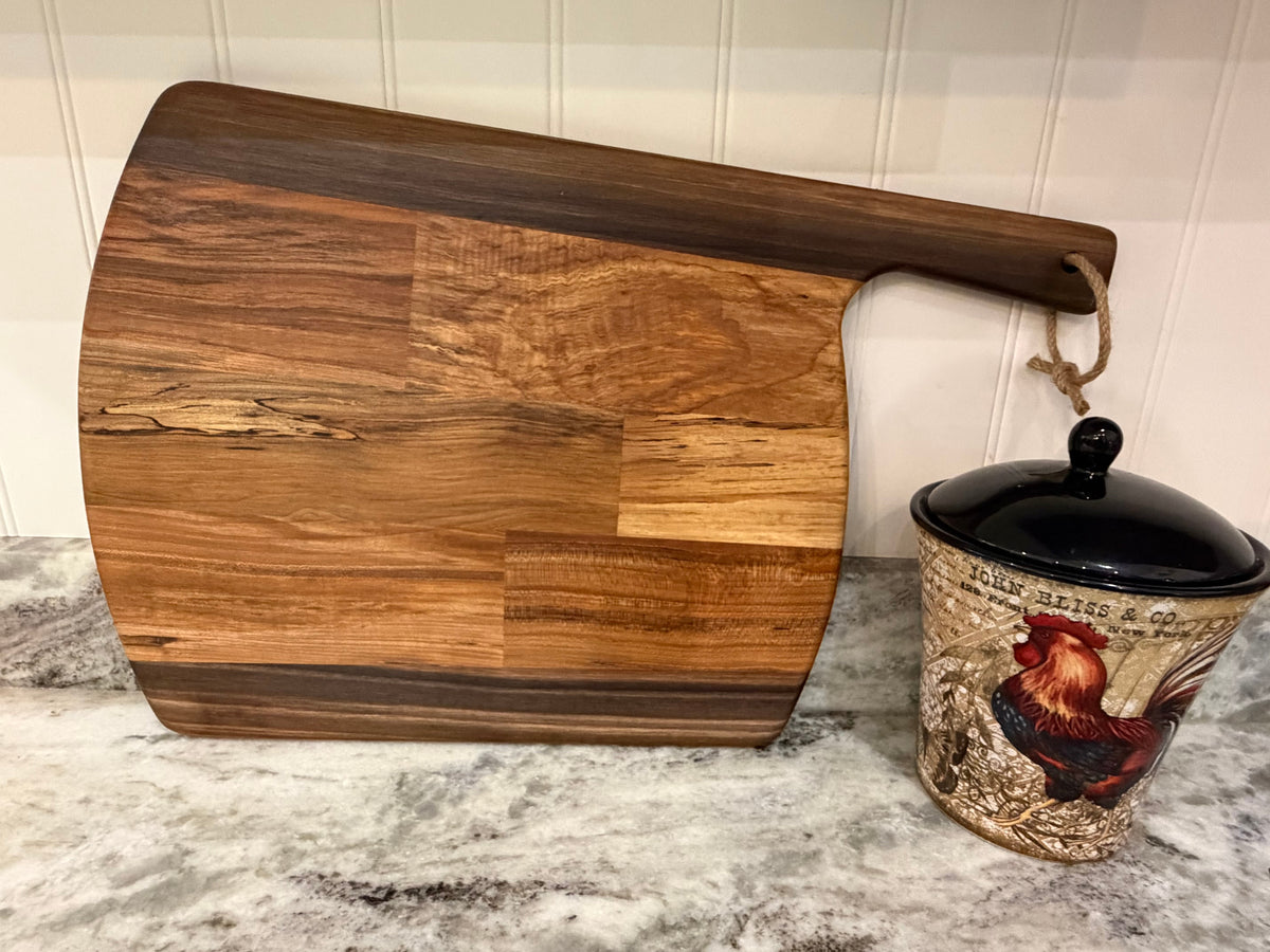 Crown N Thread handmade oiled wood charcuterie board with a natural grain finish and rustic hanging rope handle