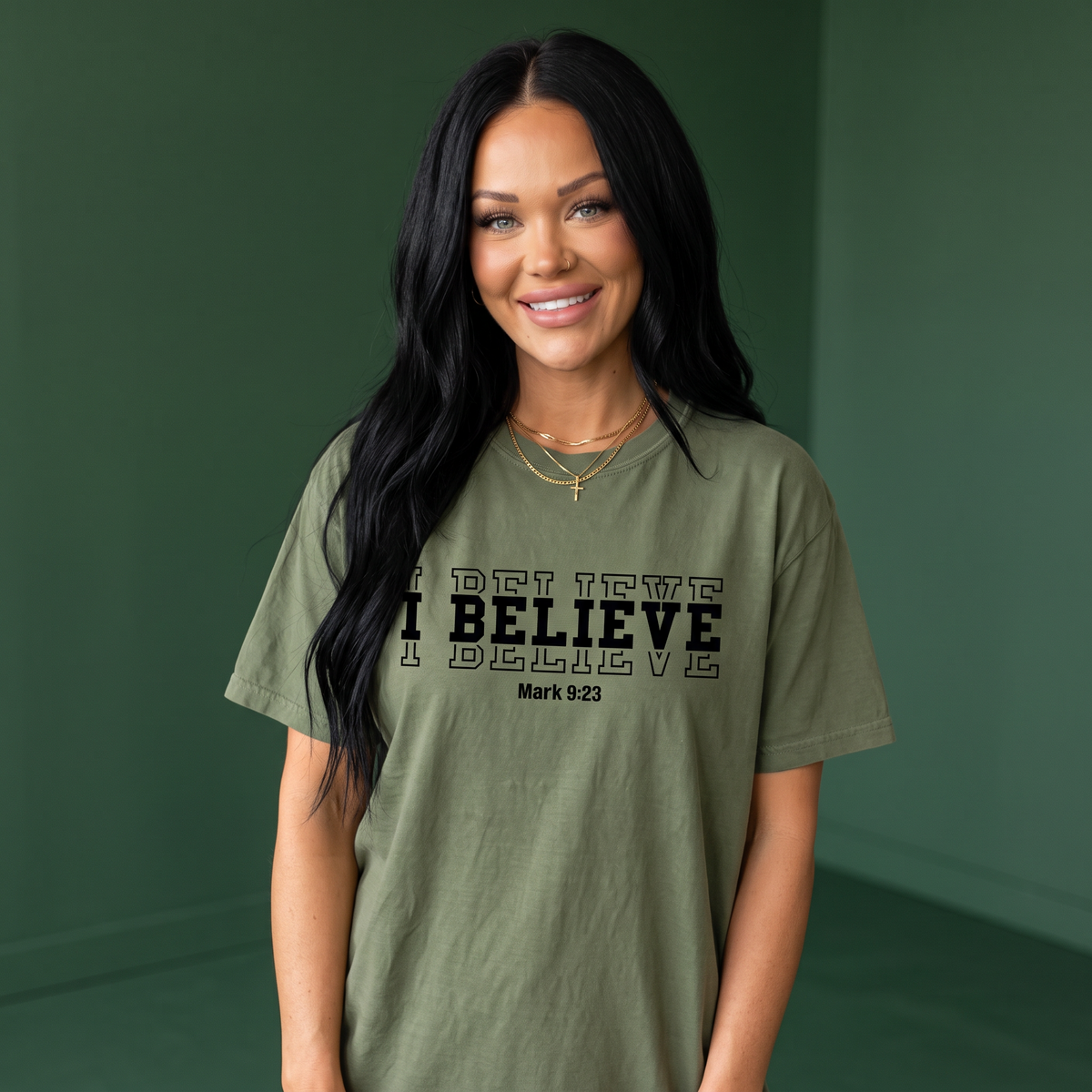 Crown N Thread olive green heavyweight ring-spun cotton graphic t-shirt with I Believe text on a smiling woman