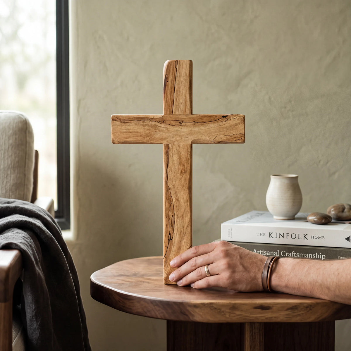 Crown N Thread handcrafted rustic wooden cross wall hanging with natural wood grain texture on a wooden side table
