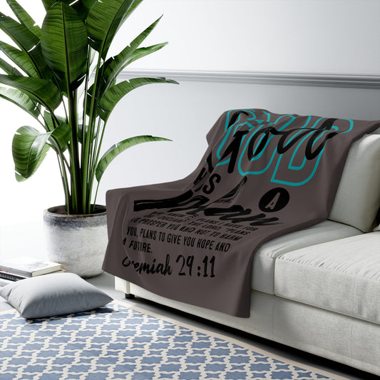 Crown N Thread sherpa fleece throw blanket featuring teal and black Jeremiah 29:11 scripture on a modern gray couch.